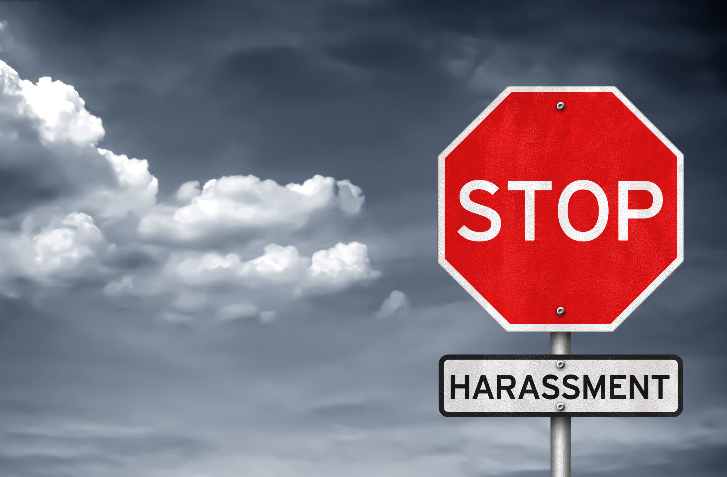 image of stop sign saying "stop harassment"